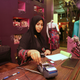 A Saudi saleswoman works in a boutique at a mall in Jeddah January 9, 2012. In a country where women are banned from driving and need the permission of a close male relative to work, travel and even have certain kinds of surgery, female employment is another battleground between traditionalists and those who want change. Women account for only 7 percent of Saudis employed by private companies but make up almost half of all Saudis listed as looking for work, according to 2009 government figures. Picture taken January 9, 2012.
